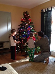 Boys putting up tree